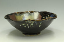 Load image into Gallery viewer, Ceramic bowl with black glaze and decorative patterns on a white background