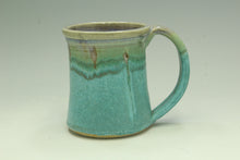 Load image into Gallery viewer, Turquoise ceramic mug with a green rim on a light gray background