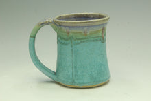 Load image into Gallery viewer, Turquoise ceramic mug with a handle on a light gray background