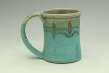 Load image into Gallery viewer, Green ceramic mug on a light gray background