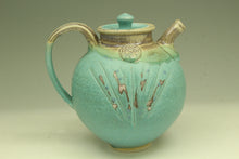 Load image into Gallery viewer, Turquoise ceramic teapot with decorative patterns on a beige background