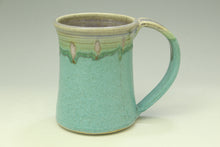 Load image into Gallery viewer, Green ceramic mug with a textured surface on a light gray background