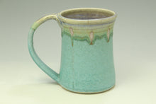 Load image into Gallery viewer, Green ceramic mug with a textured surface on a white background