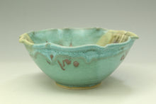 Load image into Gallery viewer, Green ceramic bowl with decorative patterns on a light gray background
