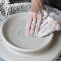 Throwing  a clay on a wheel